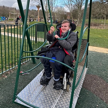 young person on accessible swing